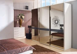 Wardrobe in the bedroom with a mirror photo