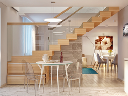 Kitchen in a house with stairs to the second floor design photo