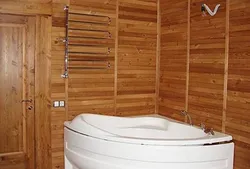 Bathroom made of plastic panels design in a wooden house