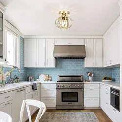 White Kitchen With Blue Apron Photo