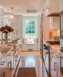 Walk-Through Kitchen Design With A Window And Two Doors
