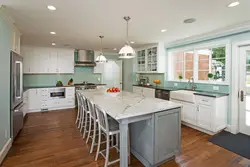 Walk-through kitchen design with a window and two doors