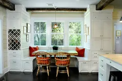 Walk-through kitchen design with a window and two doors