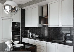 Photo of a kitchen with a black countertop and apron photo
