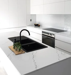 Photo of a kitchen with a black countertop and apron photo
