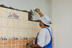 Laying Tiles In The Kitchen Photo