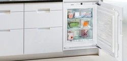 Freezer and refrigerator in the kitchen photo