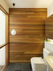 Finishing the bathroom with wooden panels photo