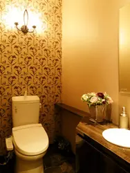 Photo of renovation of a toilet in an apartment with wallpaper