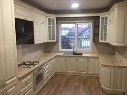 Built-in corner kitchen with window photo