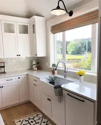 Built-in corner kitchen with window photo