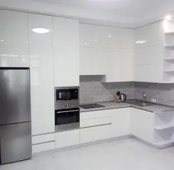 Interior of a white glossy corner kitchen