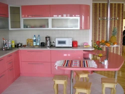 Coral-colored kitchen in the interior