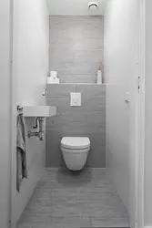 Toilet Design In An Apartment With Pipes Photo