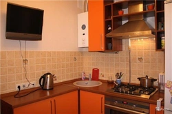 Kitchens in Khrushchev with a gas water heater and a refrigerator photo 5