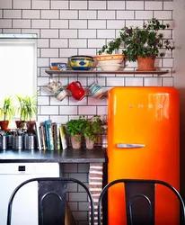 Kitchen design with orange refrigerator