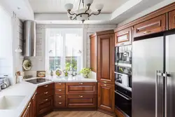 Kitchen design in a modern style with a window in the middle photo