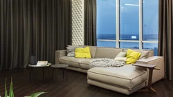 Sofa by the window in the living room photo in modern style