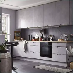 Gray kitchen in the interior combination with wallpaper