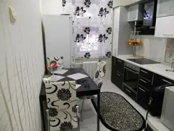 Black wallpaper in the kitchen in the interior