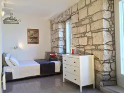 Photo Of A Bedroom With Decorative Stone Photo