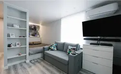 Design of a room with a bed and a sofa in a studio apartment