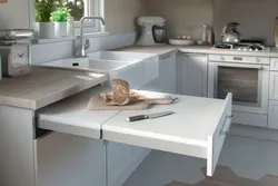 Ошхонаҳо бо мизи кашолашаванда аз зери акси countertop