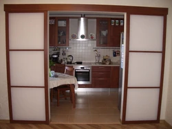 Doors to the kitchen photo of a small apartment