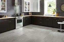 Kitchen with gray floor in the interior photo