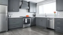 Kitchen with gray floor in the interior photo