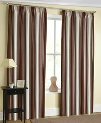 Chocolate curtains in the living room interior