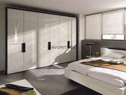 Photo of a bedroom in a modern style with a compartment