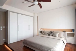 Photo of a bedroom in a modern style with a compartment