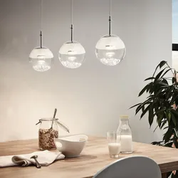 Photo of a house kitchen with chandeliers