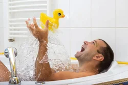 Photo of a man in a bath