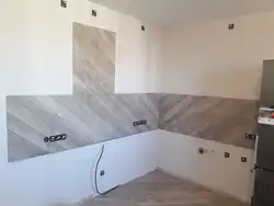 Renovation of kitchen walls with laminate photo