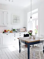 Kitchen interior with white table