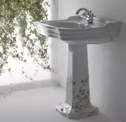 Sink with pedestal in the bathroom interior