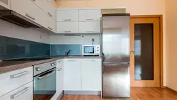 Kitchen interior refrigerator by the window