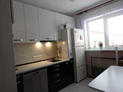 Kitchen interior refrigerator by the window