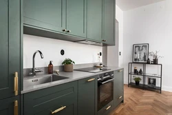 Green kitchen with wooden countertops in the interior