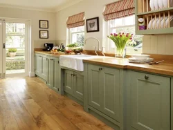 Green kitchen with wooden countertops in the interior