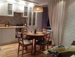 Chandelier above the dining table in the kitchen photo