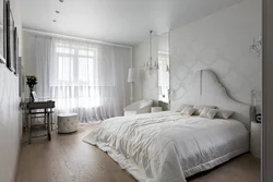 White wallpaper in the bedroom interior photo