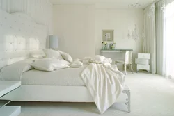 White wallpaper in the bedroom interior photo