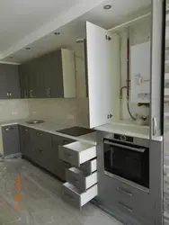 Kitchen Design With A Gas Boiler In The Corner On The Wall