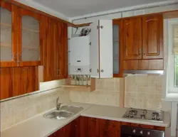 Kitchen design with a gas boiler in the corner on the wall