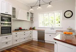 Kitchen located by the window photo