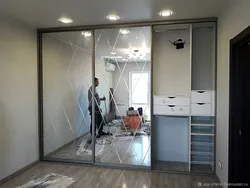 Wardrobe with mirror in the living room photo