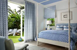 Blue curtains in the bedroom interior